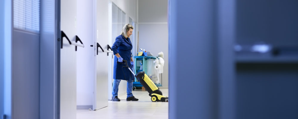 Women at workplace, professional female cleaner washing floor in Woman working, professional maid cleaning and washing floor with machinery in industrial building